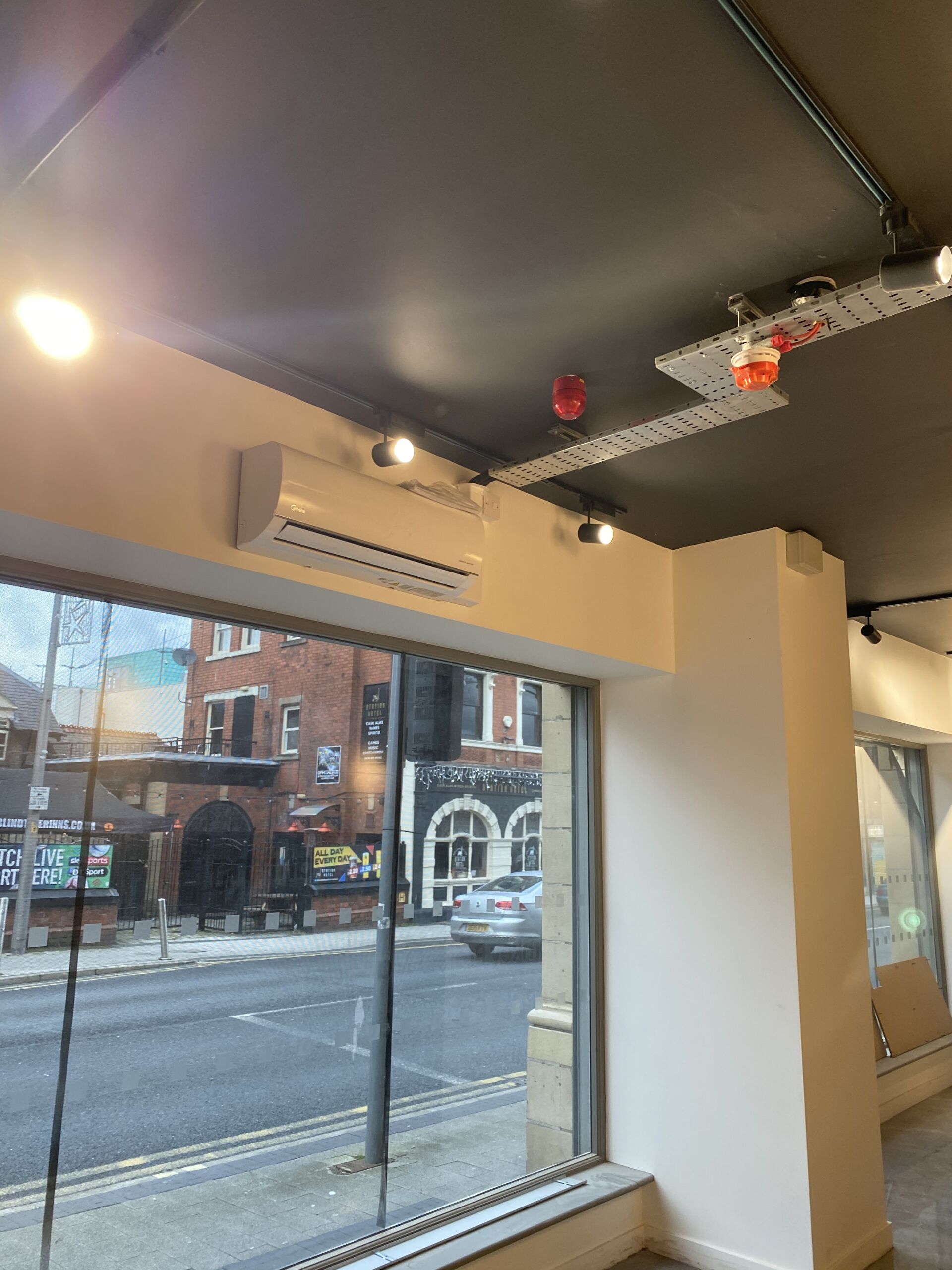 Air conditioning unit installed on a wall in a commercial property